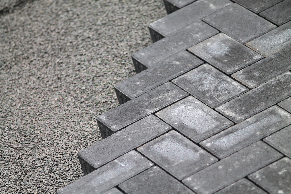 Gray cement bricks and little stones building a floor. Gray cement bricks and little stones building a floor.