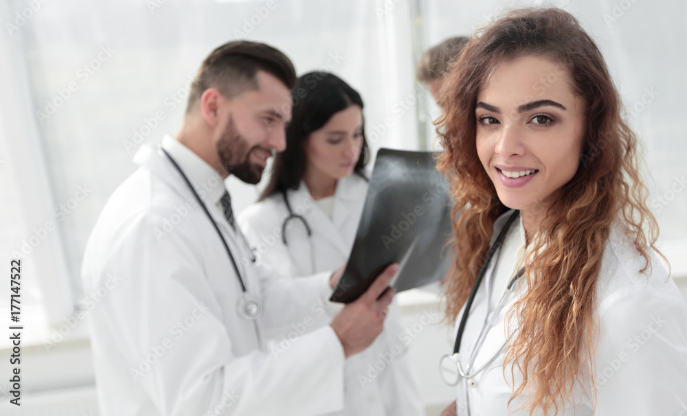confident doctors in hospital looking at x-ray. confident doctors in hospital looking at x-ray.