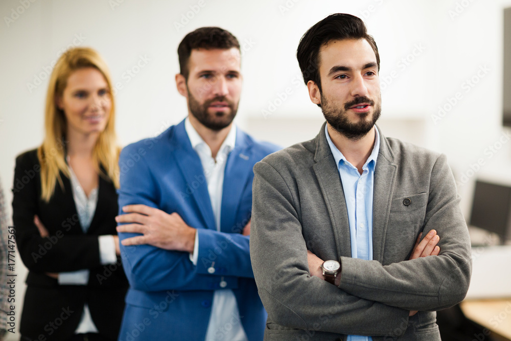 Team of cheerful businesspeople posing for group picture Team of cheerful businesspeople posing for group picture