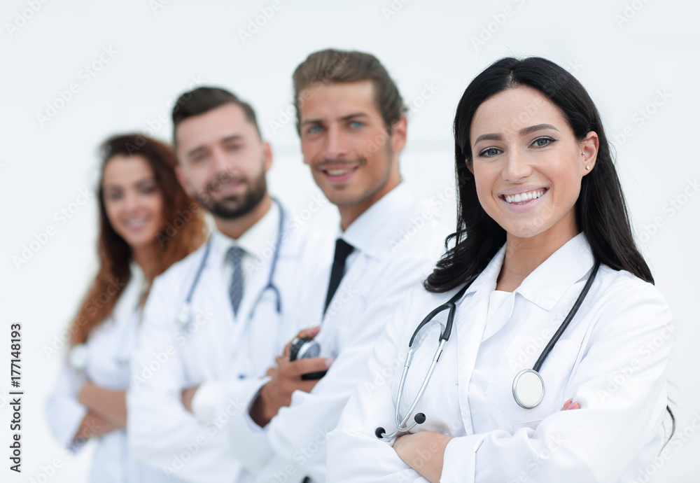 woman doctor on the background of colleagues woman doctor on the background of colleagues