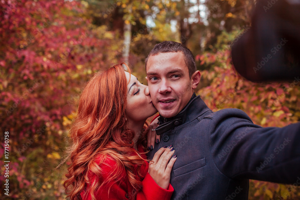 Couple taking selfie in autumn forest Couple taking selfie in autumn forest