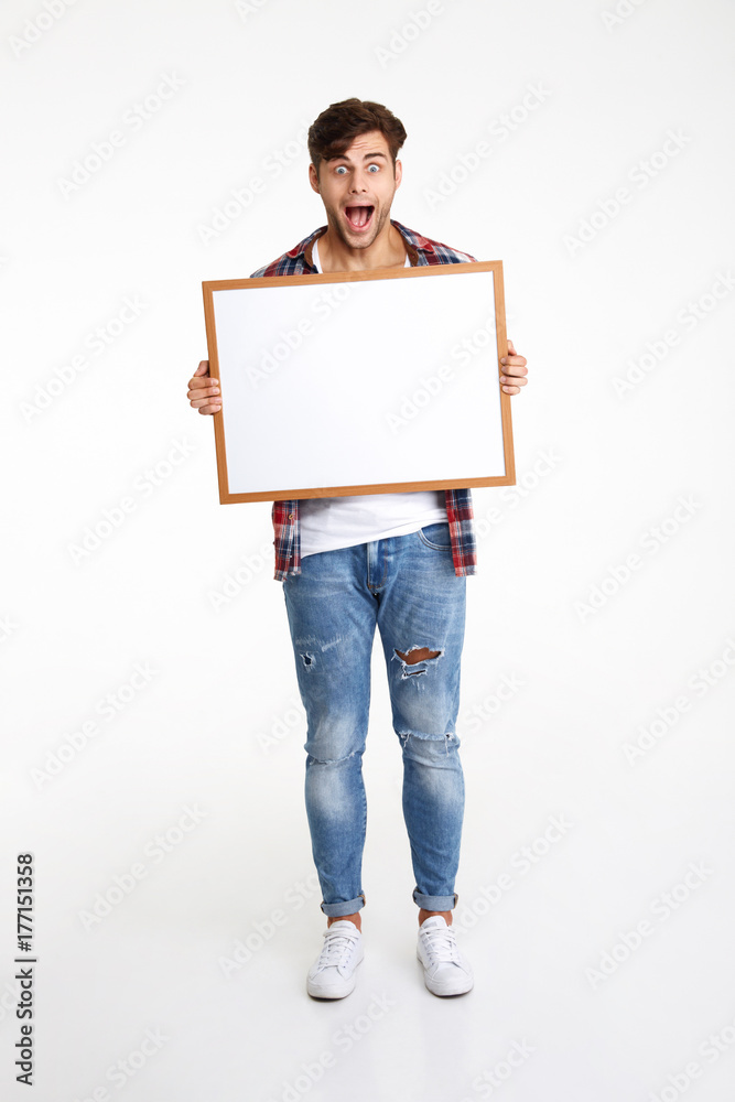 Full length portrait of an amused cheerful guy Full length portrait of an amused cheerful guy