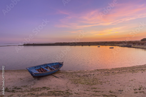 Sunset seascape view of Olhao salt marsh Inlet  waterfront to Ria Formosa natural park. Algarve.