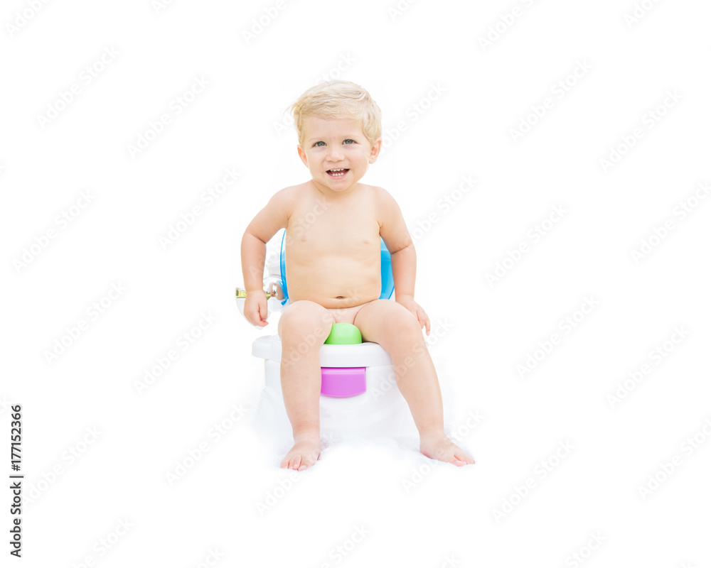 Infant boy, white caucasian smiling and sitting on the potty with white background.
Infant boy, white caucasian smiling and sitting on the potty with white background.