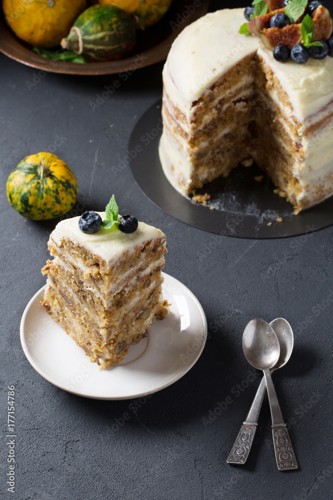 Pumpkin cake with cream cheese, vertical, selective focus
Pumpkin cake with cream cheese, vertical, selective focus