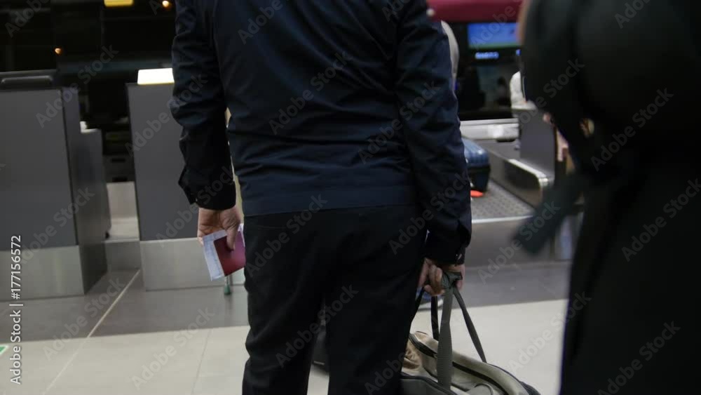 Check-in in the airport - passengers standing in queue Check-in in the airport - passengers standing in queue
