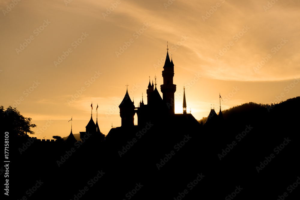 silhouette of castle with sunset sky.