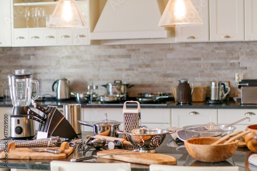 Kitchen utensils on wooden table knives blender
