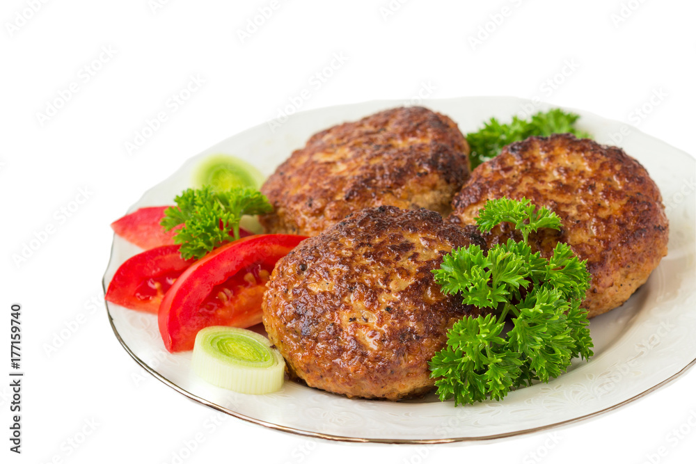 Homemade cutlets with a tomatoes, parsley  on a plate. White background.