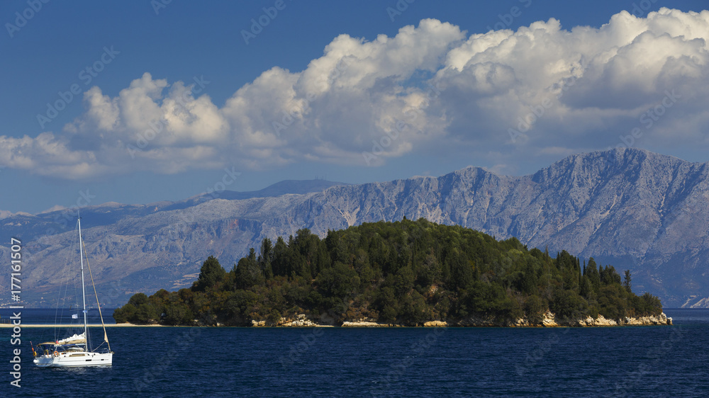 Sail boat at the coast of Skorpios island in Ionian sea, Greece.
