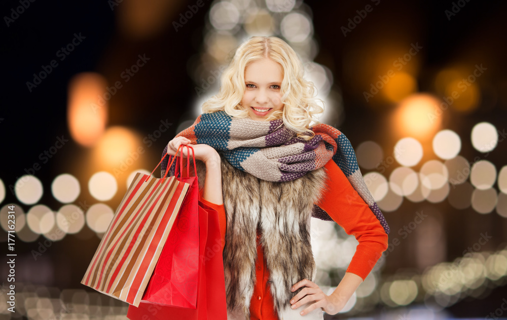 young woman in winter clothes with shopping bags
