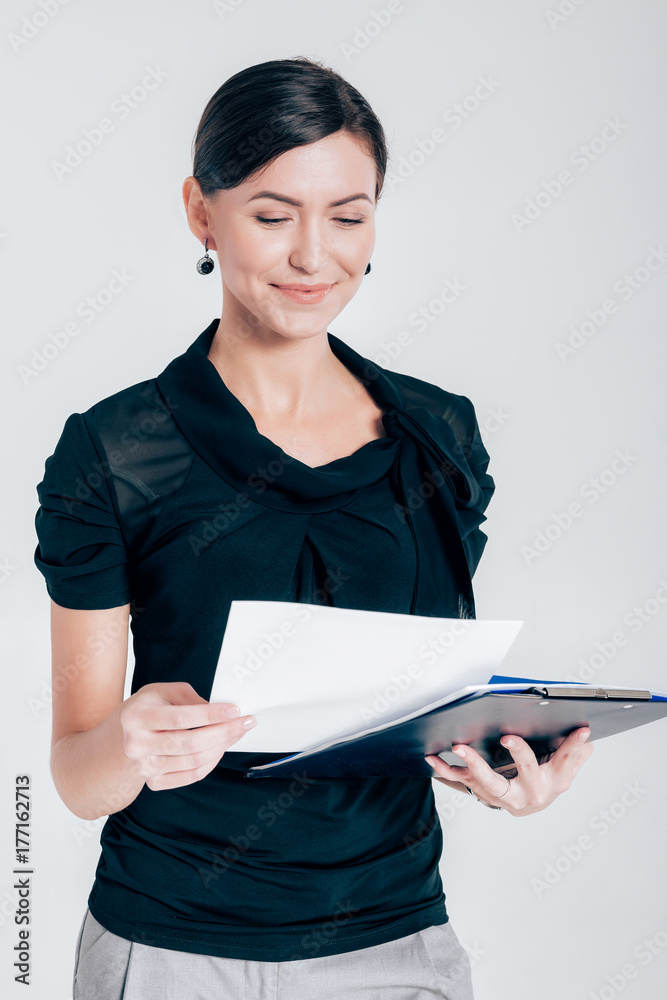 attractive business woman on gray background