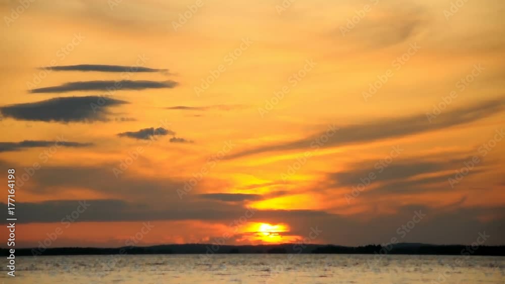 Evening sunset clouds over lake Evening sunset clouds over lake