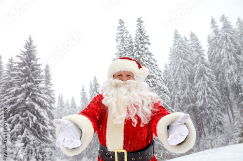 Santa Claus on snow in winter at Christmas.