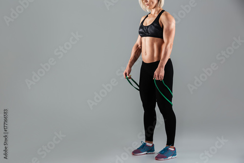 Cropped image of a fit muscular adult sportswoman