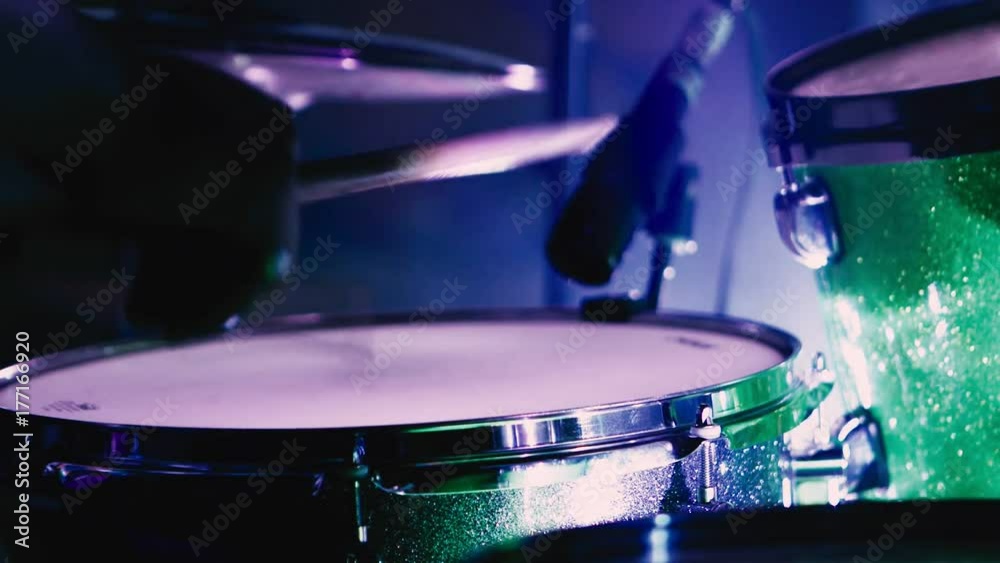 A snare drummer does a marching snare drum roll. Isolated over a white background.