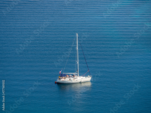 Sailing yacht in Croatia, windy summer on the boat between rocky islands of the Mediterranean sea