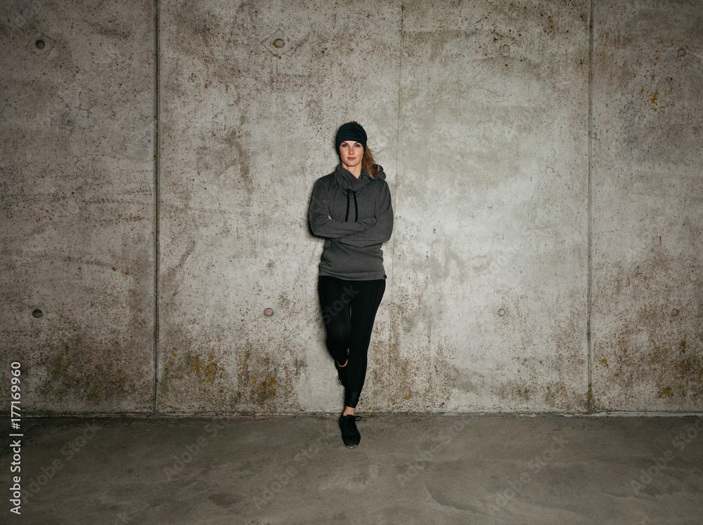 Fit young woman taking a break after running