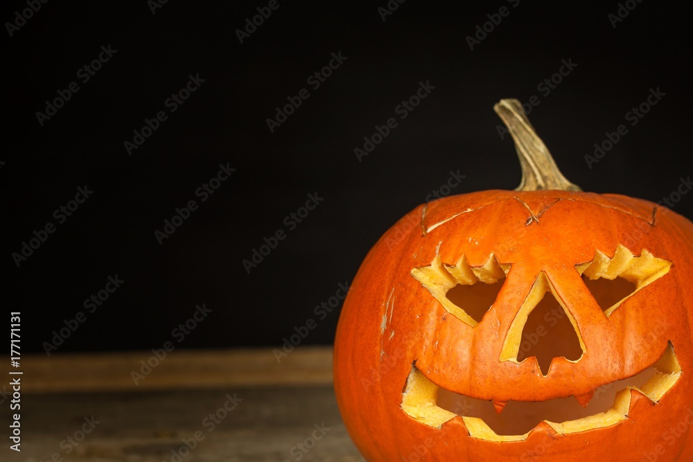 Detail of carved pumpkin. Halloween Celebration. Traditional decoration of the pumpkin. Detail of carved pumpkin. Halloween Celebration. Traditional decoration of the pumpkin.