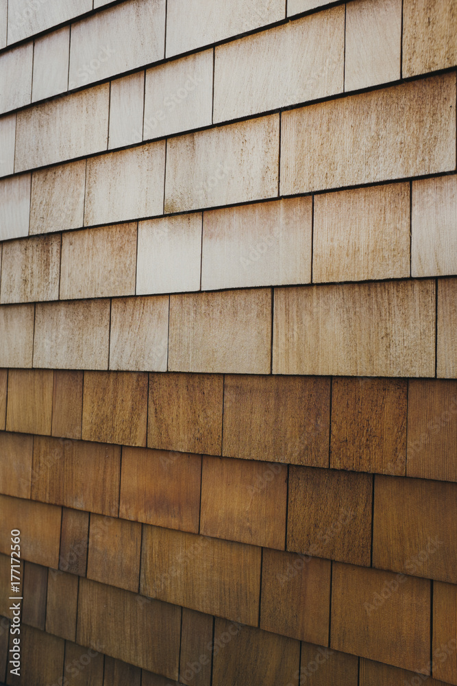 Cedar shingles on building wall exterior Cedar shingles on building wall exterior