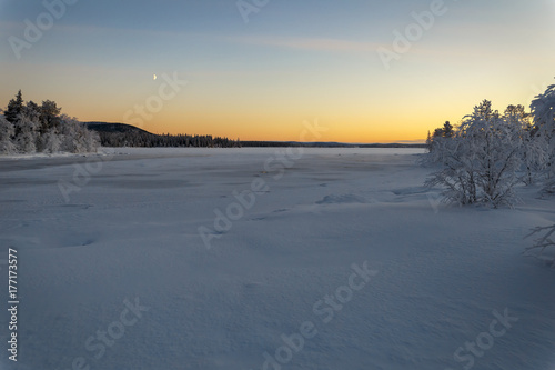 Winter lake in Finland at sunset © kochievmv