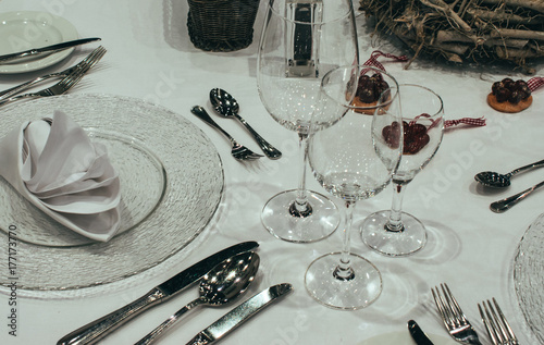 Serving of the festive table.Christmas table setting photo