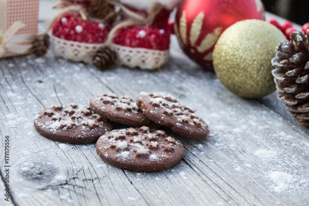 Cocoa cookies and spices on a wooden background near, Christmas decorations Cocoa cookies and spices on a wooden background near, Christmas decorations