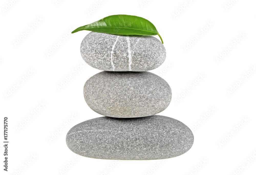 Fototapeta premium Spa stones and green leaf isolated on a white background