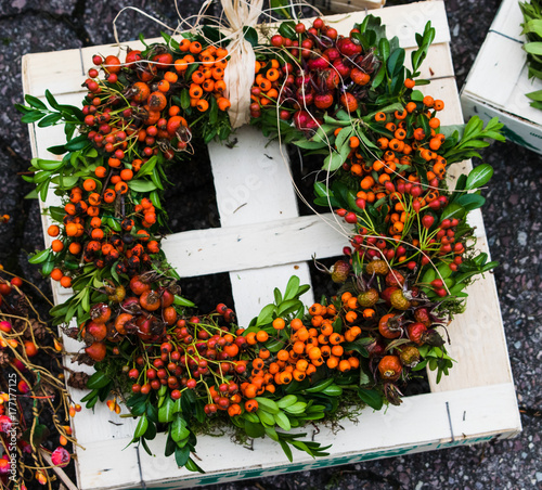 autumn wreath with berries rose hip, hawthorn and rowan berry	