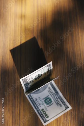 Overhead view of US dollar bills on the table photo