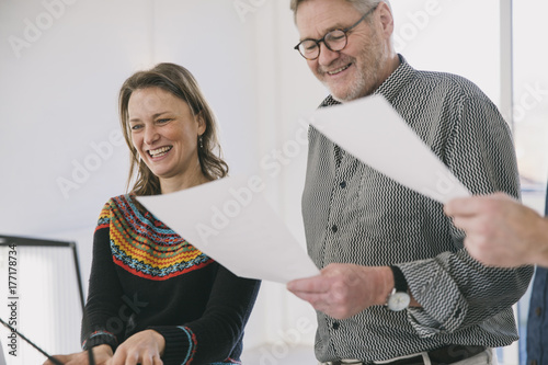 Three people practicing in a choir