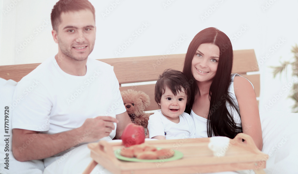 Smiling family having breakfast Smiling family having breakfast