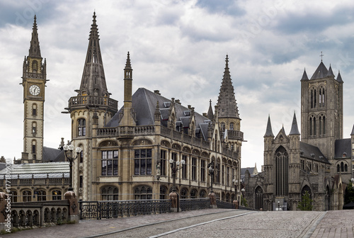 View from Sint-Michielsplein (St Michael's Bridge) at Clock tower, Old post office and Saint-Nicholas Church in Ghent, Belgium. Medieval buildings and towers