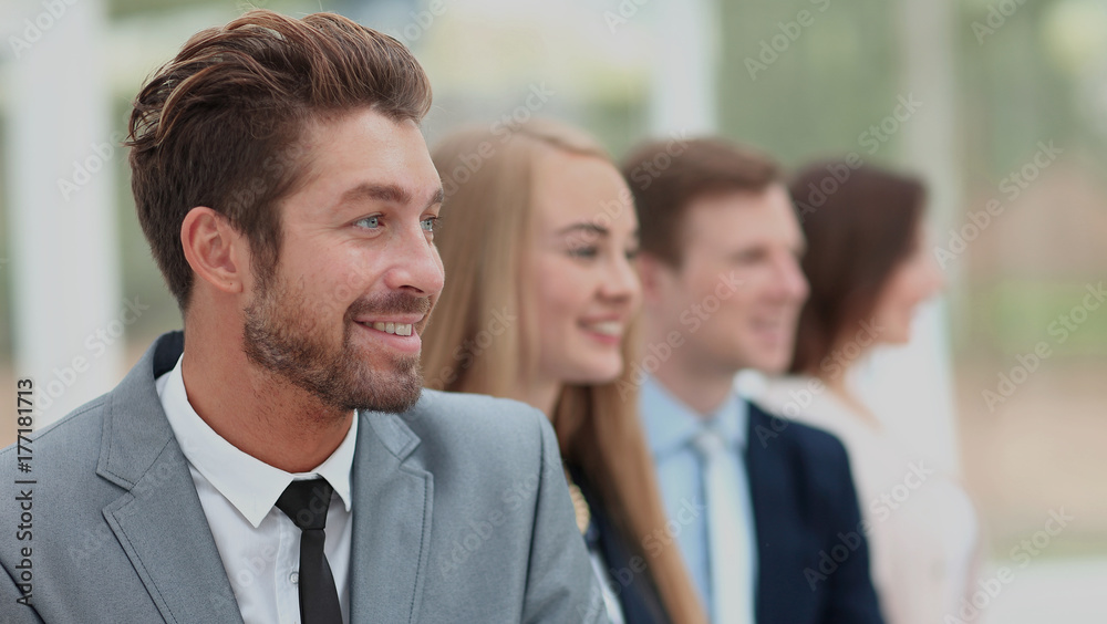 group of business people smiling in an office group of business people smiling in an office