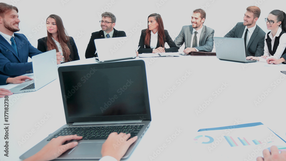 Side View Of Businesspeople Analyzing Graph In Office Side View Of Businesspeople Analyzing Graph In Office