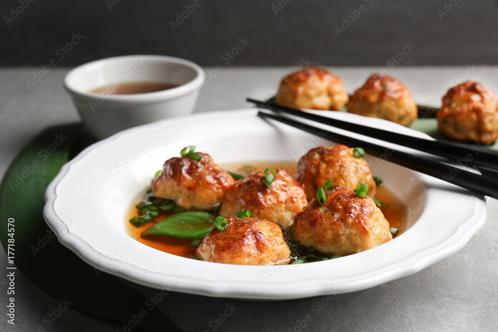 Delicious meatballs with sauce in plate on table Delicious meatballs with sauce in plate on table