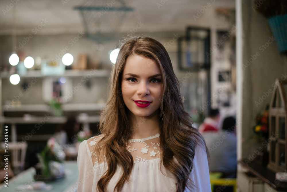 Portrait of a beautiful brunette at the cafe Portrait of a beautiful brunette at the cafe