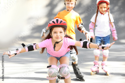 Cute girl rollerblading in ...