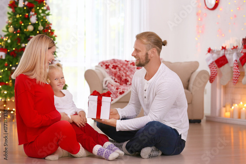 Happy couple with daughter ...