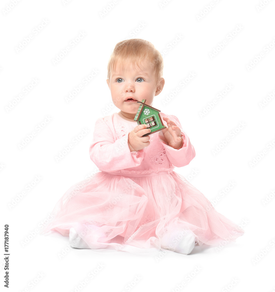 Adorable baby with small house toy on white background Adorable baby with small house toy on white background