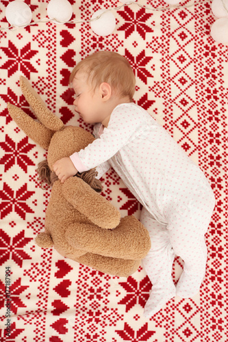 Cute baby sleeping with toy...