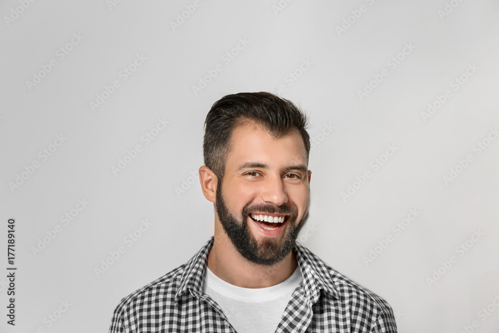 Obraz premium Handsome man on light background