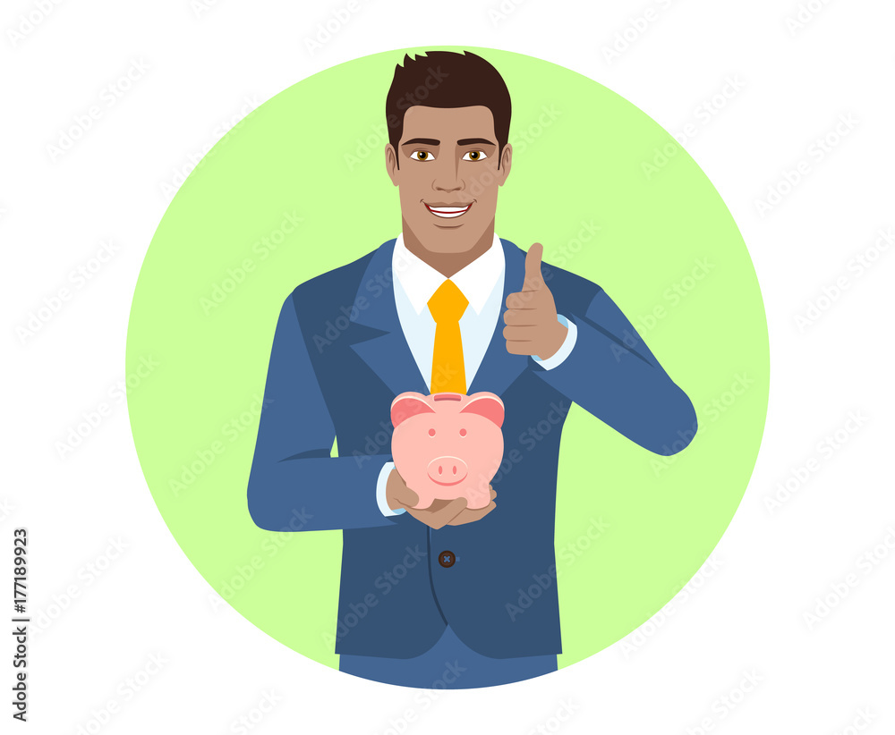 Businessman holding a piggy bank and showing thumb up Businessman holding a piggy bank and showing thumb up