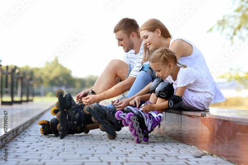 Family with roller skates i...