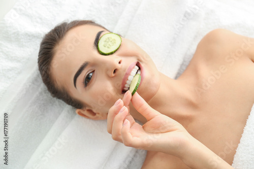 Young woman with cucumber s...
