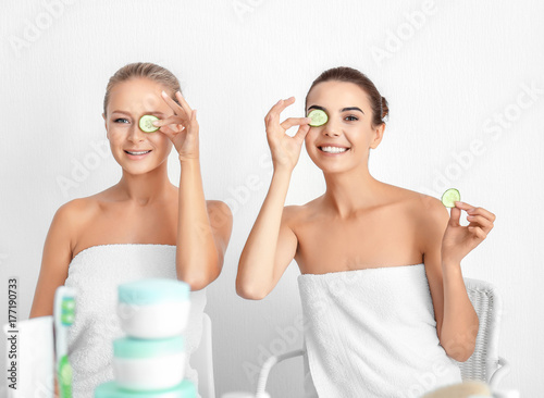 Young women with cucumber s...