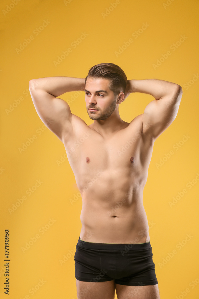 Fototapeta premium Sexy shirtless man in underwear on color background