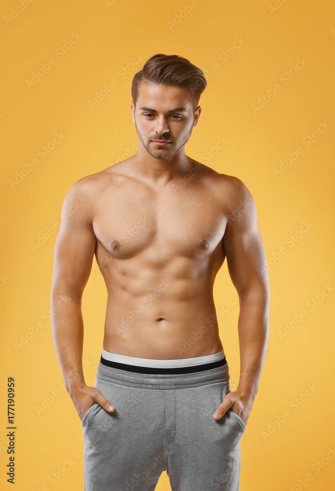 Sexy shirtless man on color background