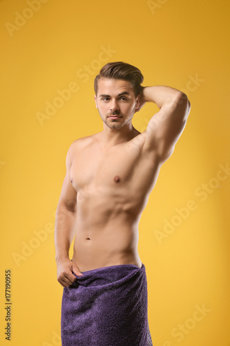 Sexy man wrapped in towel o...