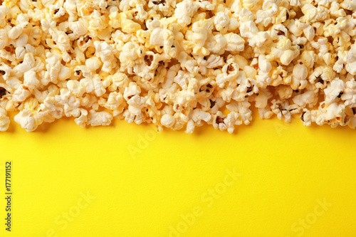 Popcorn on color background